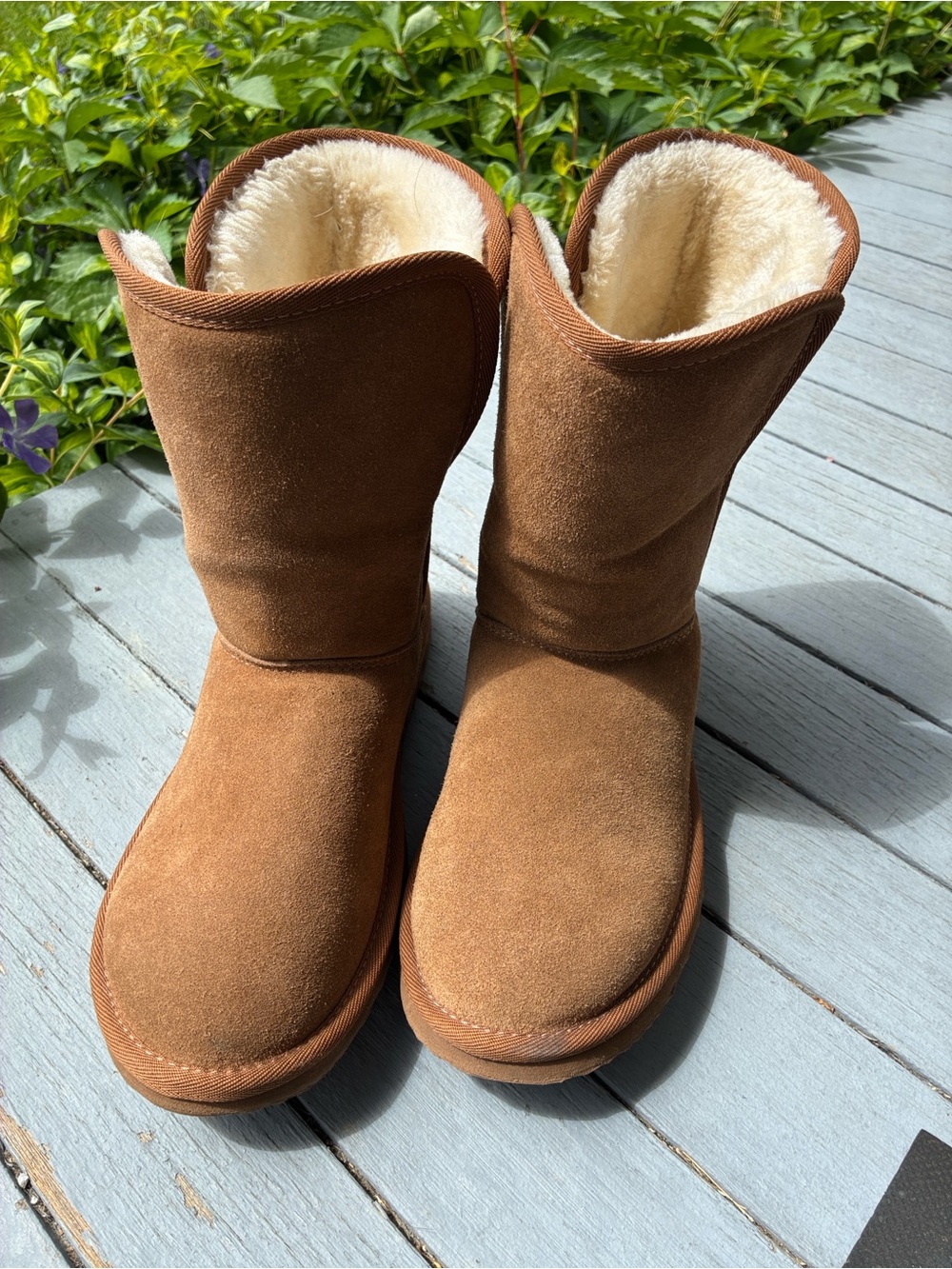 Tan boots, probably size 9.